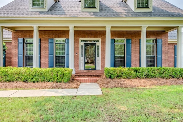 3049 Fieldcrest Dr, Montgomery, AL 36106 - doorway to property with brick siding, a shingled roof, and covered porch