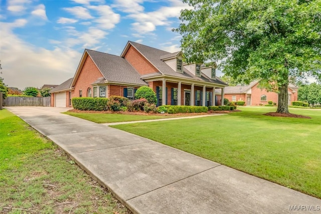 3049 Fieldcrest Dr, Montgomery, AL 36106 - new england style home with concrete driveway, brick siding, and a garage