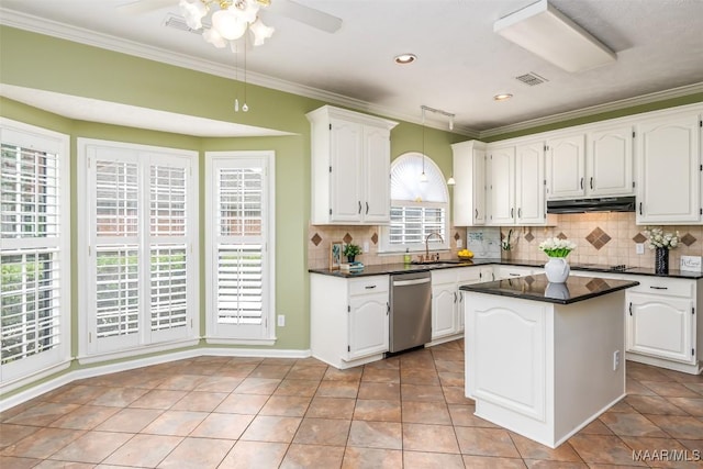 3049 Fieldcrest Dr, Montgomery, AL 36106 - kitchen with dishwasher, dark countertops, a sink, crown molding, and white cabinetry