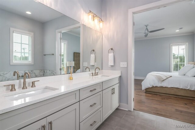 7175 Fain Park Loop, Montgomery, AL 36117 - ensuite bathroom with double vanity, ceiling fan, tile patterned flooring, baseboards, and recessed lighting