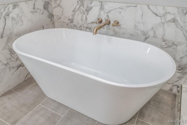 7175 Fain Park Loop, Montgomery, AL 36117 - bathroom with a soaking tub and tile walls