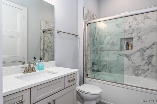 7175 Fain Park Loop, Montgomery, AL 36117 - bathroom with vanity, toilet, and bath / shower combo with glass door