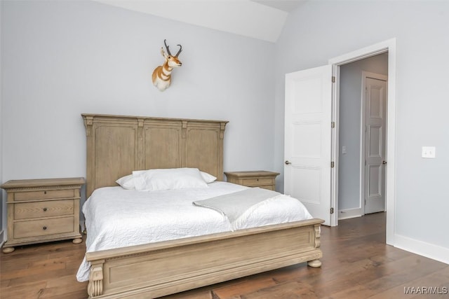 7175 Fain Park Loop, Montgomery, AL 36117 - bedroom with lofted ceiling, wood finished floors, and baseboards