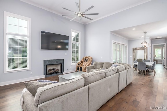 7175 Fain Park Loop, Montgomery, AL 36117 - living room with ornamental molding, a ceiling fan, wood finished floors, a premium fireplace, and baseboards