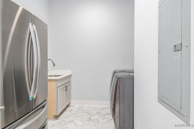 7175 Fain Park Loop, Montgomery, AL 36117 - laundry room featuring light marble finish flooring, washer and clothes dryer, and baseboards