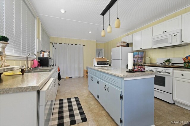 8099 County Road 59, Verbena, AL 36091 - kitchen featuring white appliances, a sink, a center island, blue cabinets, and pendant lighting