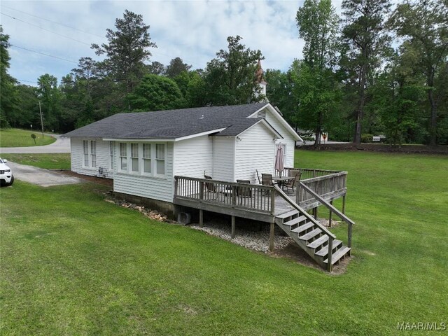 8099 County Road 59, Verbena, AL 36091 - rear view of property with a deck, a yard, a shingled roof, and view of scattered trees