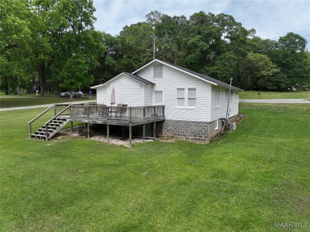 8099 County Road 59, Verbena, AL 36091 - back of house with a wooden deck, central air condition unit, and a yard