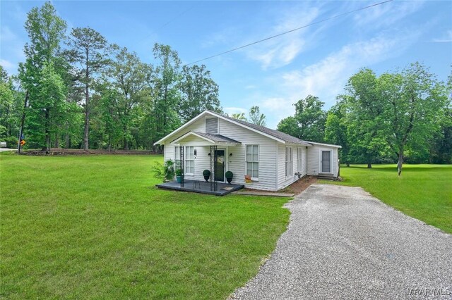 8099 County Road 59, Verbena, AL 36091 - view of front of house featuring a front lawn, a porch, and asphalt driveway