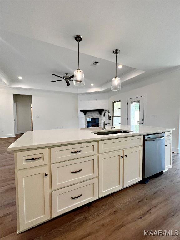 40 Serene Ln, Wetumpka, AL 36093 - kitchen featuring dishwasher, a raised ceiling, open floor plan, dark wood-type flooring, and light countertops