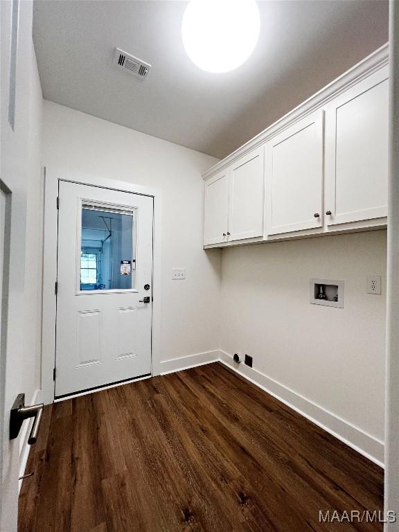 40 Serene Ln, Wetumpka, AL 36093 - laundry area with cabinet space, hookup for a washing machine, and dark wood-style flooring