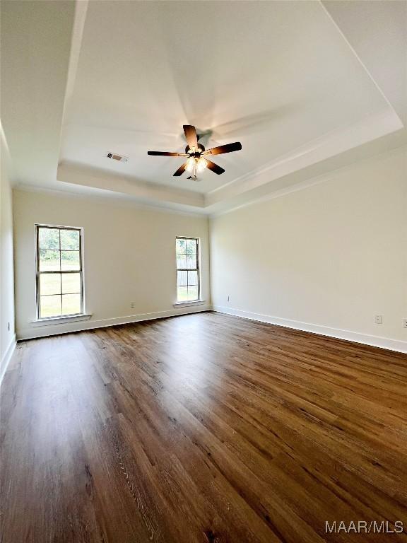 40 Serene Ln, Wetumpka, AL 36093 - unfurnished room featuring a raised ceiling, dark wood finished floors, a ceiling fan, and crown molding