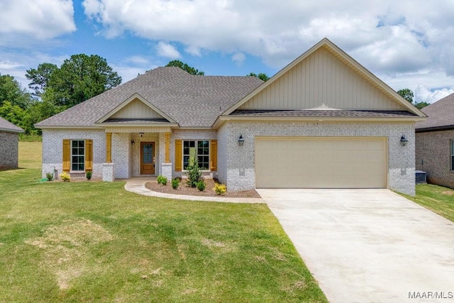 40 Serene Ln, Wetumpka, AL 36093 - craftsman-style house with brick siding, roof with shingles, driveway, an attached garage, and a front yard
