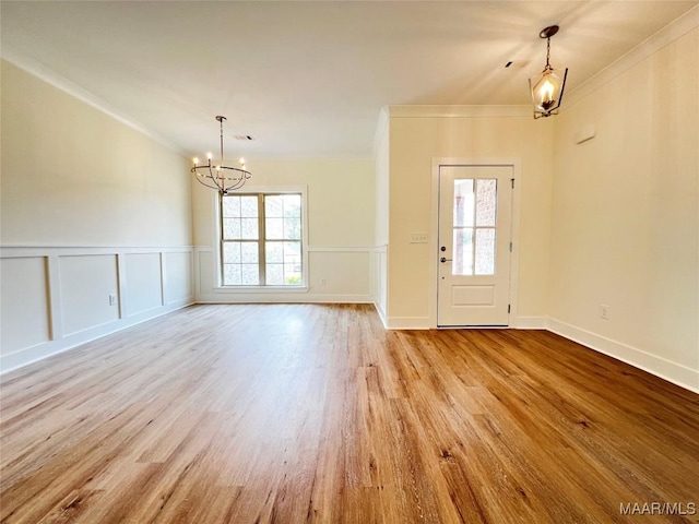 60 Serene Ln, Wetumpka, AL 36093 - entryway featuring a chandelier, ornamental molding, wood finished floors, and wainscoting
