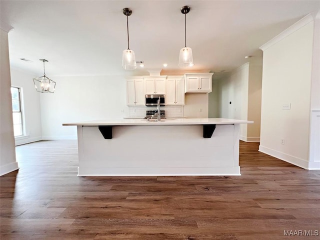 60 Serene Ln, Wetumpka, AL 36093 - kitchen with appliances with stainless steel finishes, decorative backsplash, light countertops, white cabinets, and dark wood finished floors