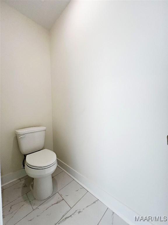 60 Serene Ln, Wetumpka, AL 36093 - bathroom featuring marble look tile flooring and toilet