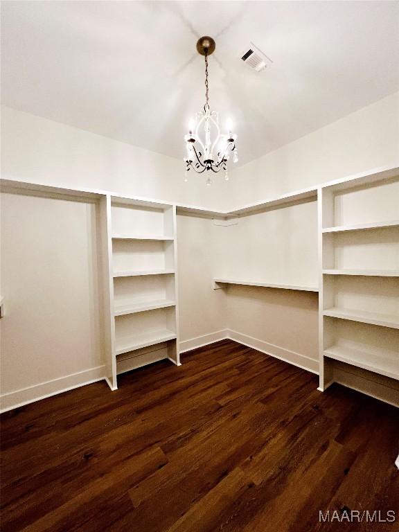 60 Serene Ln, Wetumpka, AL 36093 - walk in closet with a chandelier and wood finished floors