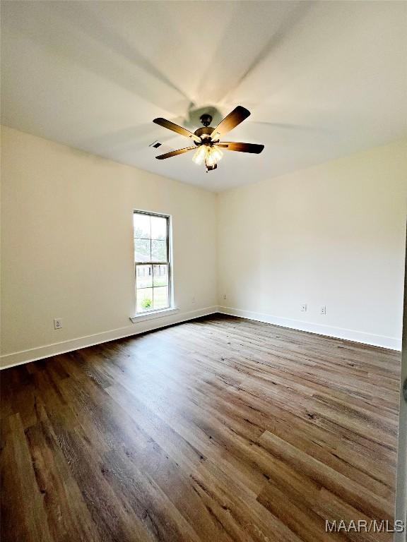 60 Serene Ln, Wetumpka, AL 36093 - spare room with dark wood-style flooring and a ceiling fan