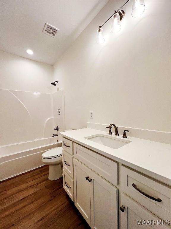 60 Serene Ln, Wetumpka, AL 36093 - bathroom featuring vanity, shower / washtub combination, and wood finished floors