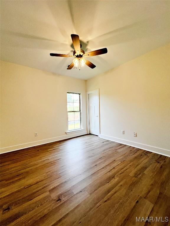60 Serene Ln, Wetumpka, AL 36093 - spare room with dark wood-style flooring, ceiling fan, and baseboards
