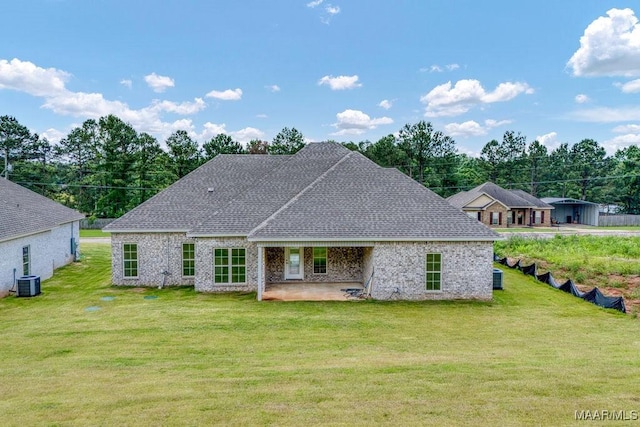 60 Serene Ln, Wetumpka, AL 36093 - back of property with a patio area, a yard, and roof with shingles