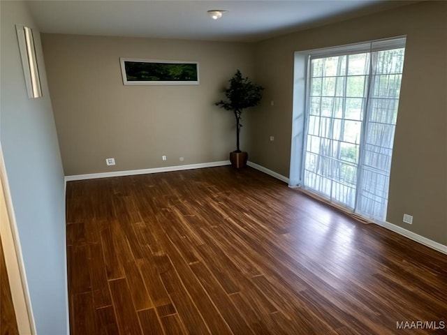1018 Hillcrest Dr, Weaver, AL 36277 - unfurnished room with wood finished floors and baseboards