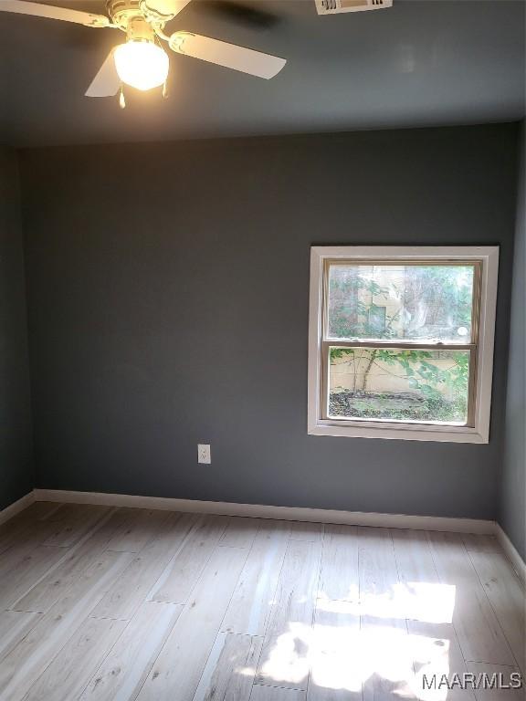 439 Gardendale Dr, Montgomery, AL 36110 - unfurnished room featuring wood finished floors, a ceiling fan, and baseboards