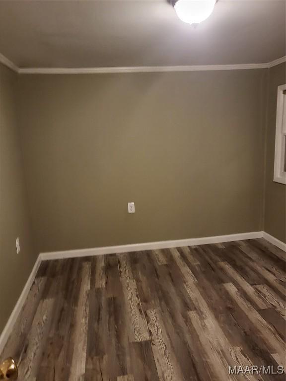 439 Gardendale Dr, Montgomery, AL 36110 - unfurnished room with crown molding, dark wood-type flooring, and baseboards