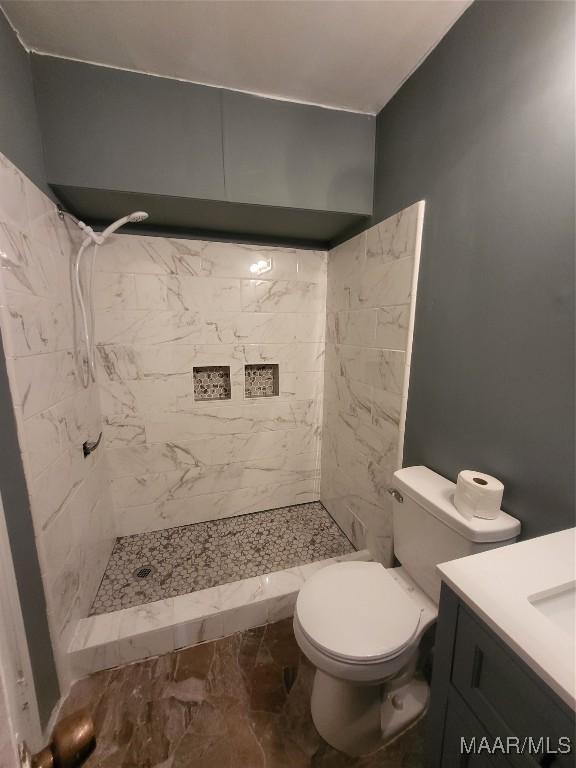 439 Gardendale Dr, Montgomery, AL 36110 - bathroom with a shower stall, vanity, and toilet