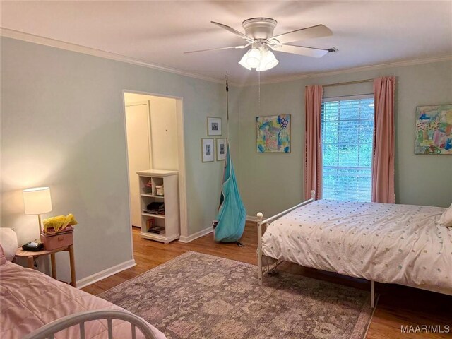 530 Palmquist Dr, Selma, AL 36701 - bedroom with wood finished floors, ornamental molding, and a ceiling fan