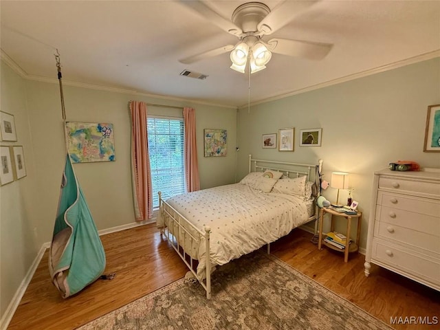 530 Palmquist Dr, Selma, AL 36701 - bedroom with wood finished floors, crown molding, and ceiling fan