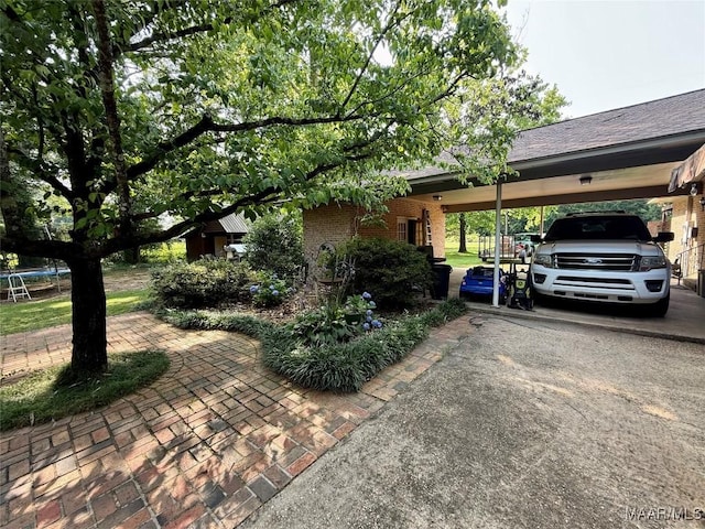 530 Palmquist Dr, Selma, AL 36701 - view of front facade featuring brick siding, a carport, and driveway