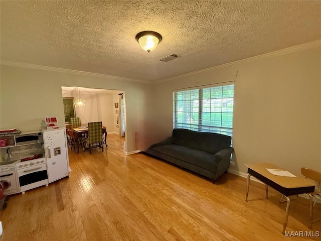 530 Palmquist Dr, Selma, AL 36701 - living area with wood finished floors, a textured ceiling, and crown molding
