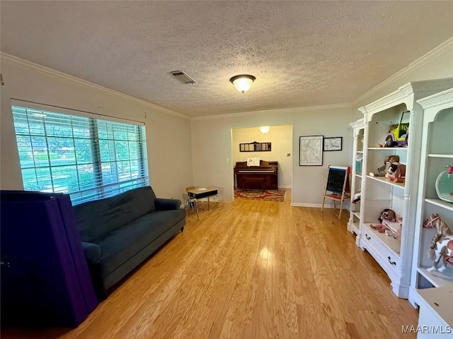 530 Palmquist Dr, Selma, AL 36701 - living room with wood finished floors, a textured ceiling, and crown molding