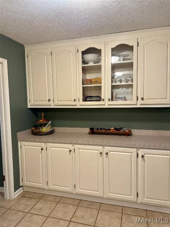 530 Palmquist Dr, Selma, AL 36701 - bar with light tile patterned flooring and a textured ceiling