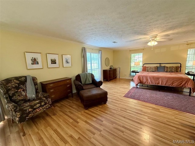 530 Palmquist Dr, Selma, AL 36701 - bedroom with light wood-style floors, ornamental molding, ceiling fan, and a textured ceiling