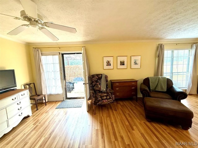 530 Palmquist Dr, Selma, AL 36701 - living area with ornamental molding, healthy amount of natural light, wood finished floors, a textured ceiling, and ceiling fan