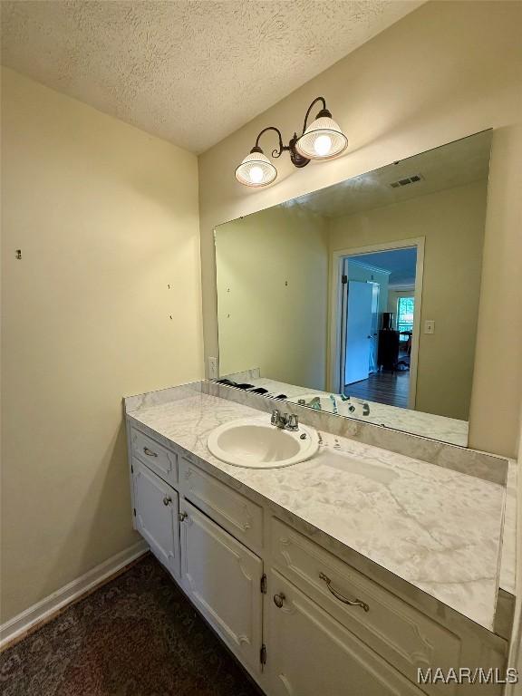 530 Palmquist Dr, Selma, AL 36701 - bathroom featuring vanity and a textured ceiling