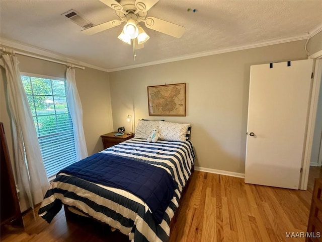 530 Palmquist Dr, Selma, AL 36701 - bedroom with light wood-style floors, crown molding, and a ceiling fan