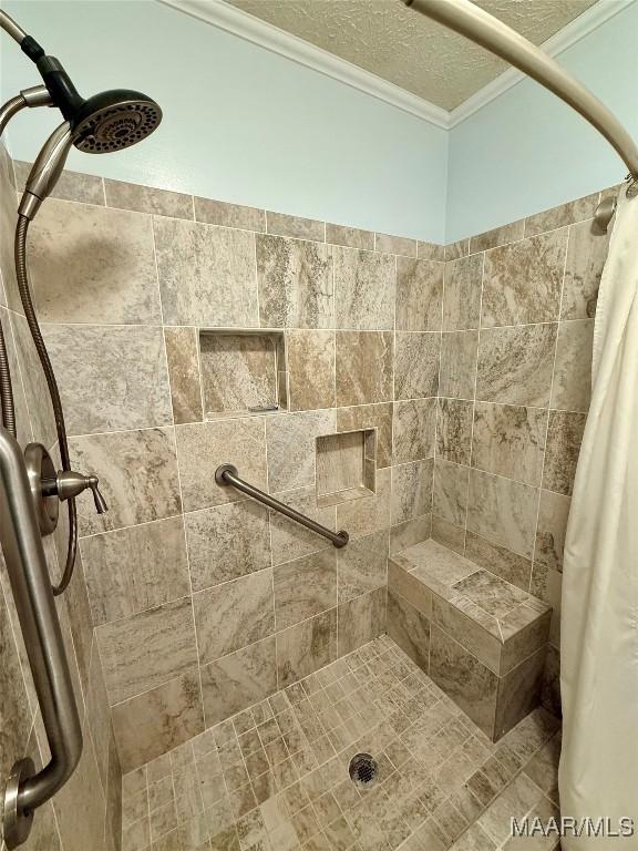 530 Palmquist Dr, Selma, AL 36701 - full bathroom featuring a tile shower, ornamental molding, and a textured ceiling