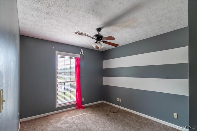 242 Preakness Path, Montgomery, AL 36117 - empty room featuring a ceiling fan, carpet floors, a textured ceiling, and baseboards
