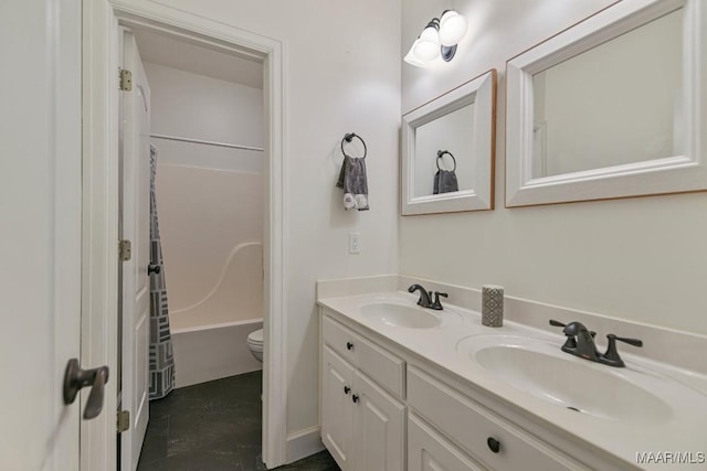 505 Mountain Ridge Rd, Millbrook, AL 36054 - full bath featuring toilet, double vanity, shower / tub combination, and tile patterned flooring