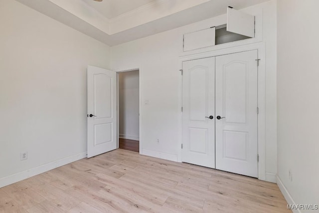 505 Mountain Ridge Rd, Millbrook, AL 36054 - unfurnished bedroom with light wood finished floors, crown molding, baseboards, and a closet