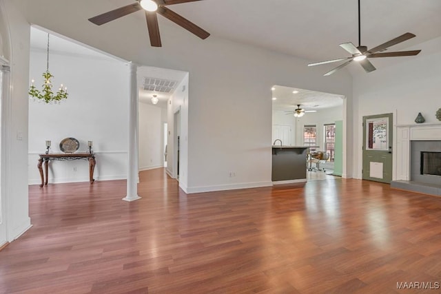 505 Mountain Ridge Rd, Millbrook, AL 36054 - unfurnished living room with a ceiling fan, wood finished floors, a fireplace, and baseboards