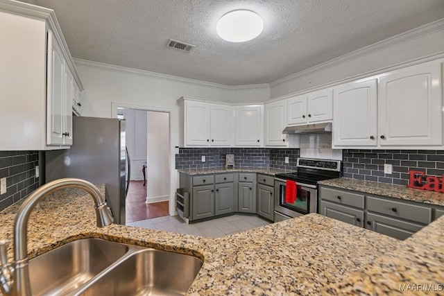 505 Mountain Ridge Rd, Millbrook, AL 36054 - kitchen with appliances with stainless steel finishes, a sink, gray cabinetry, under cabinet range hood, and white cabinets