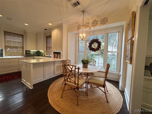 2081 Myrtlewood Dr, Montgomery, AL 36111 - dining area with dark wood-style floors, a chandelier, crown molding, and recessed lighting