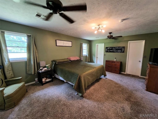 445 W Hickory Grove Rd, Lapine, AL 36046 - carpeted bedroom with a textured ceiling, baseboards, and a ceiling fan