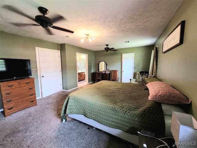 445 W Hickory Grove Rd, Lapine, AL 36046 - carpeted bedroom featuring a textured ceiling, a ceiling fan, ensuite bath, and baseboards
