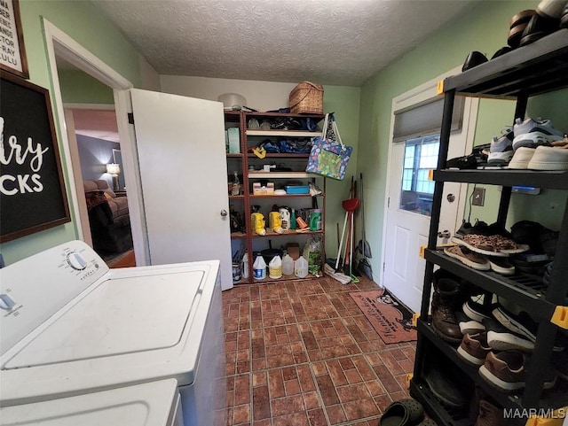 445 W Hickory Grove Rd, Lapine, AL 36046 - laundry area featuring washer / dryer, brick patterned flooring, and a textured ceiling