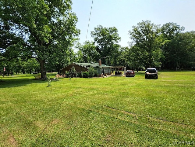 445 W Hickory Grove Rd, Lapine, AL 36046 - view of green lawn featuring view of wooded area